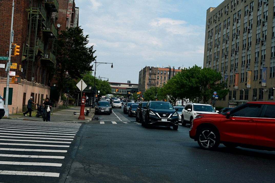 City street with cars and pedestrian crossing